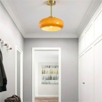 orange ceiling lamp shade hanging on the entrance door