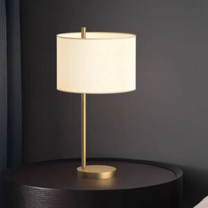 white and brass table lamp
